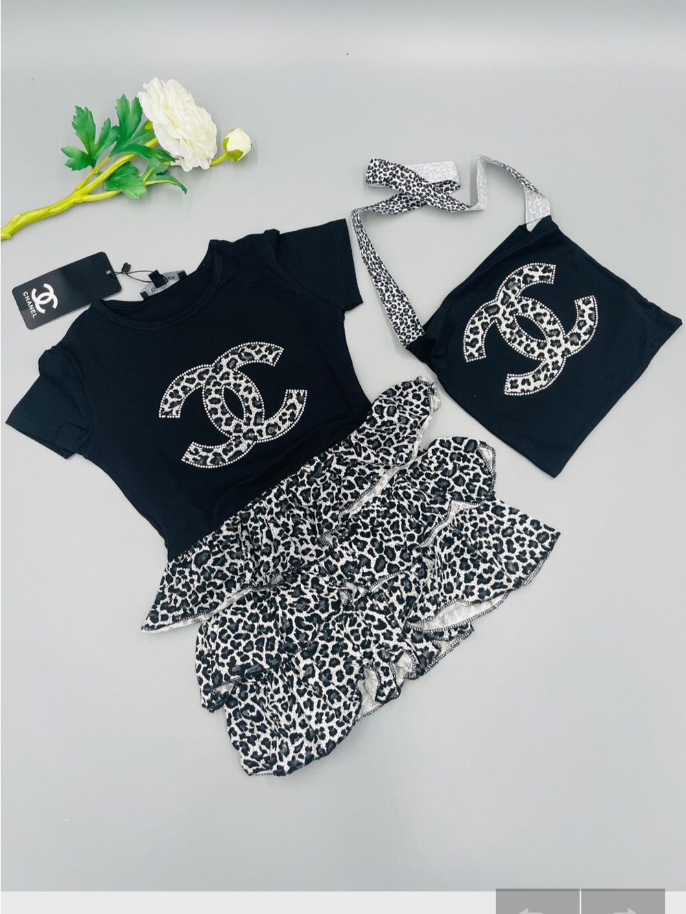 CHANEL Black Tee with Monochrome Leopard Ruffle Skirt & Pouch